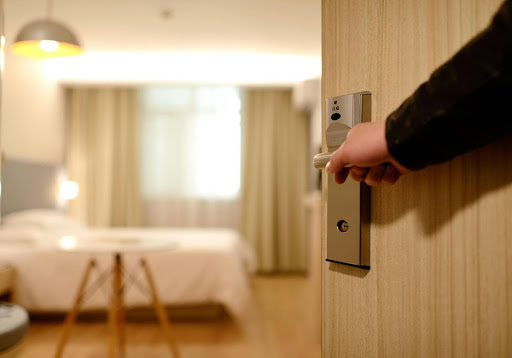 Guest entering boutique hotel room