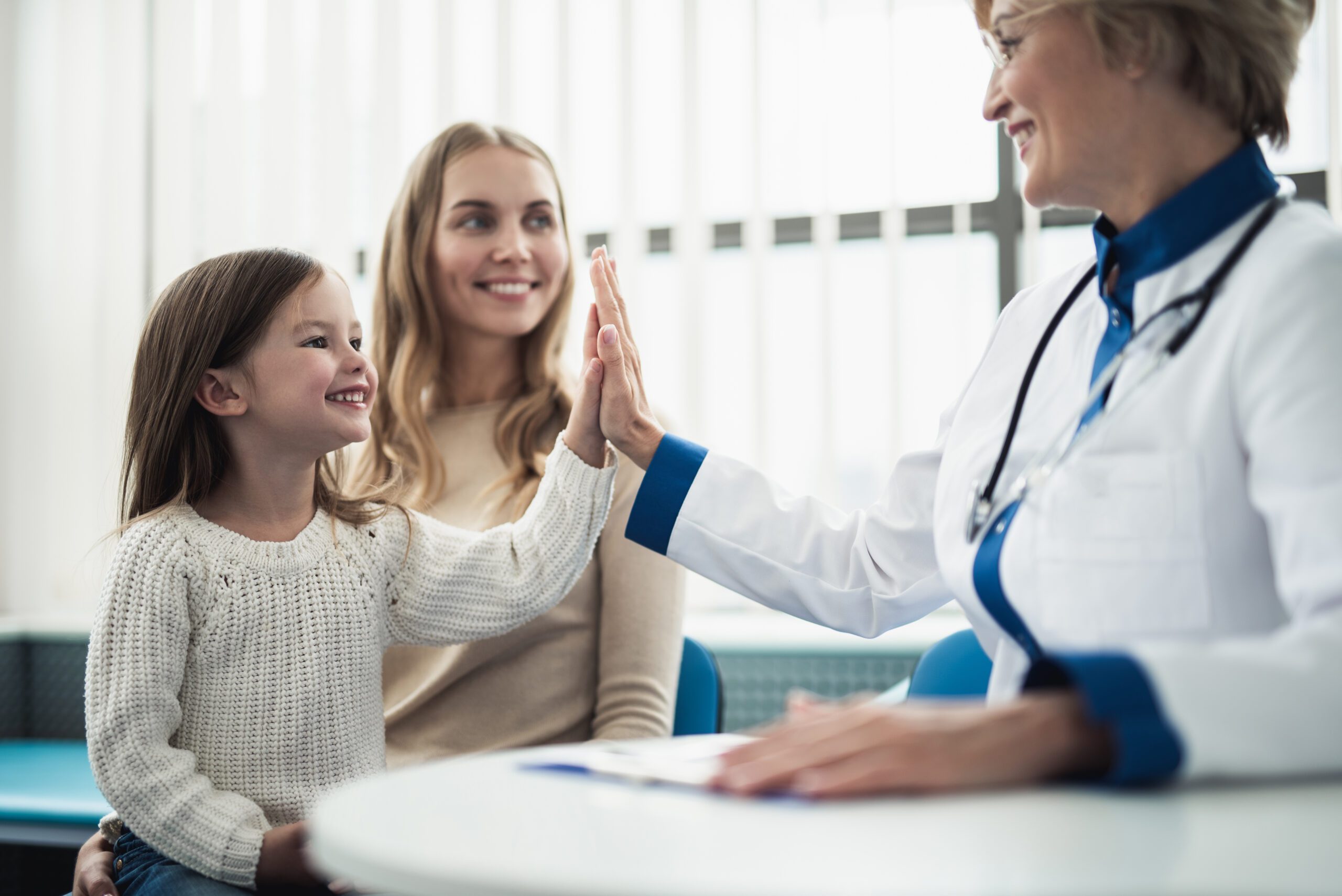 Mother and her daughter consulting with doctor in Seattle, Washington